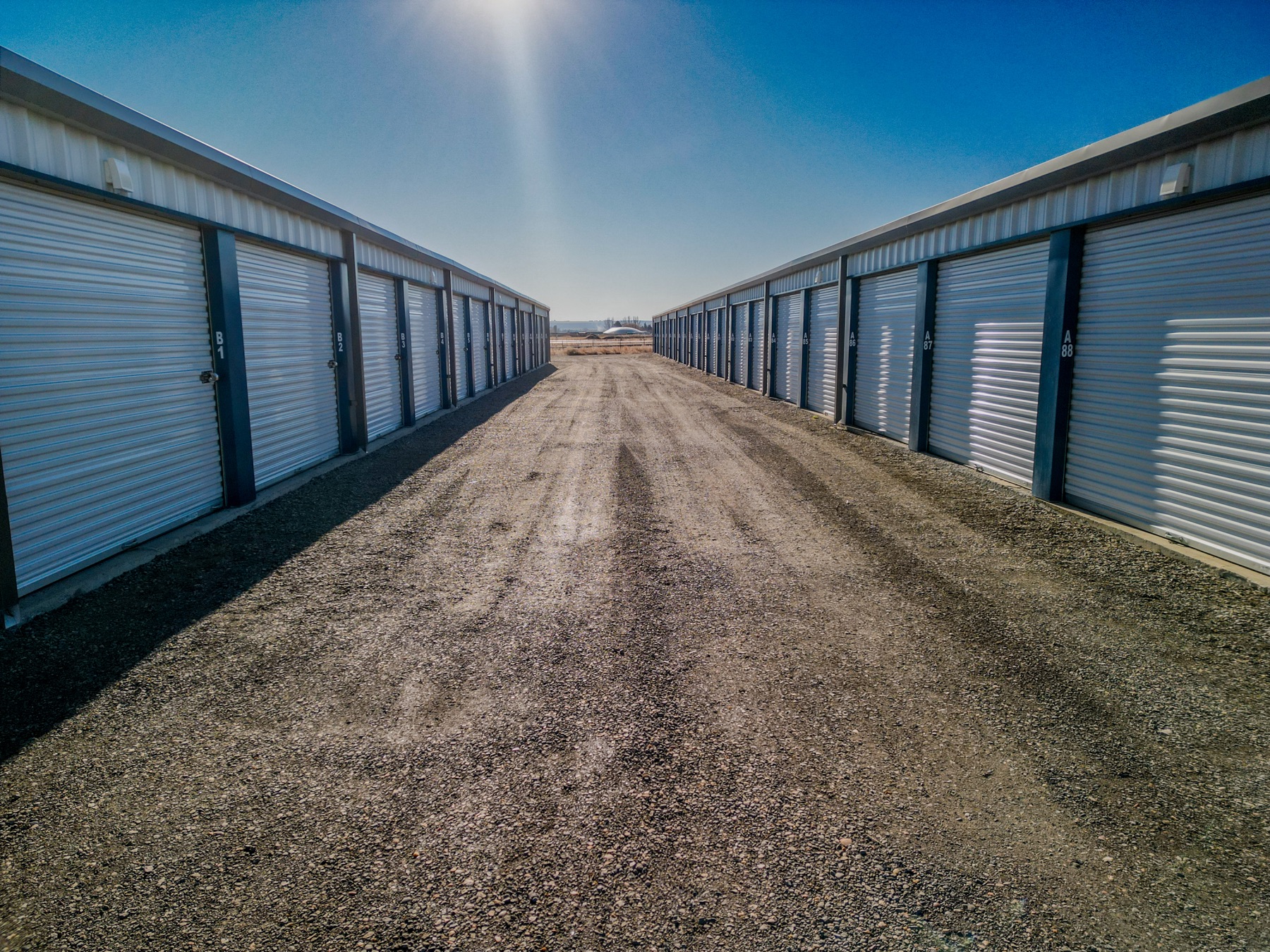 Drive aisle between storage unit rows